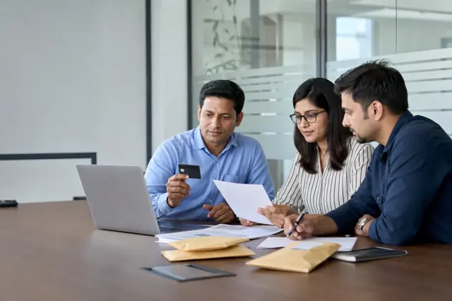 Indian consumer reviewing corporate credit card features and monthly spending