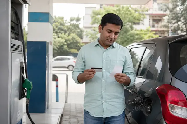 Indian consumer reviewing fuel credit card features and monthly spending