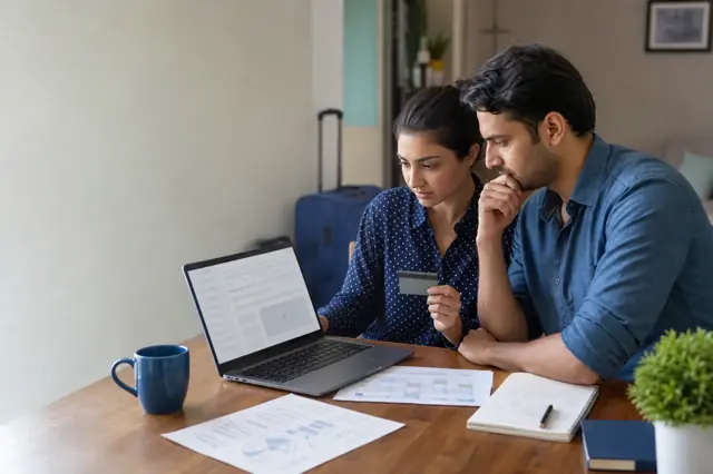 Indian consumer reviewing travel miles credit card features and monthly spending