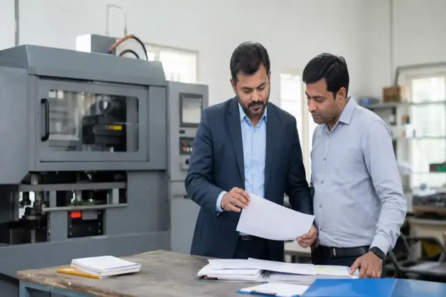 Indian business team evaluating productive equipment finance